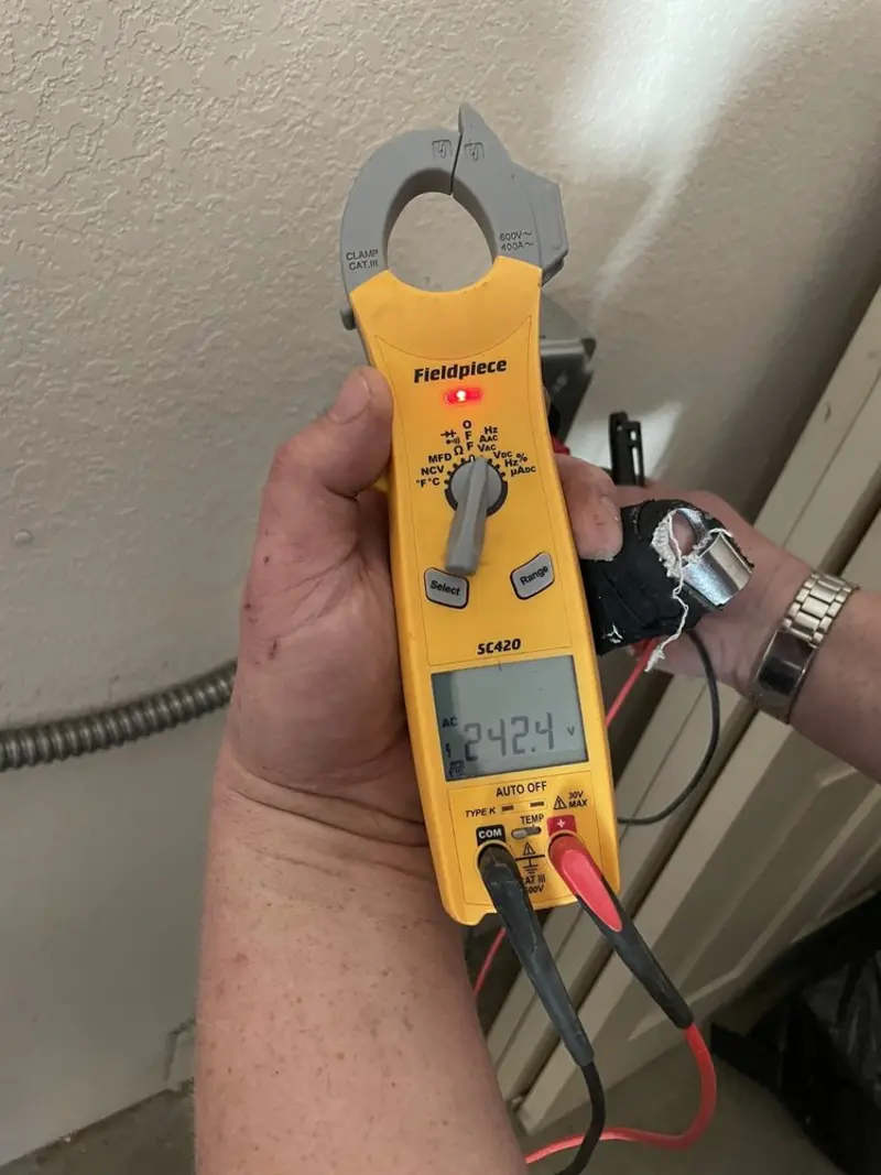 Voltage testing with clamp meter during Electrical Installation Services in South Daytona